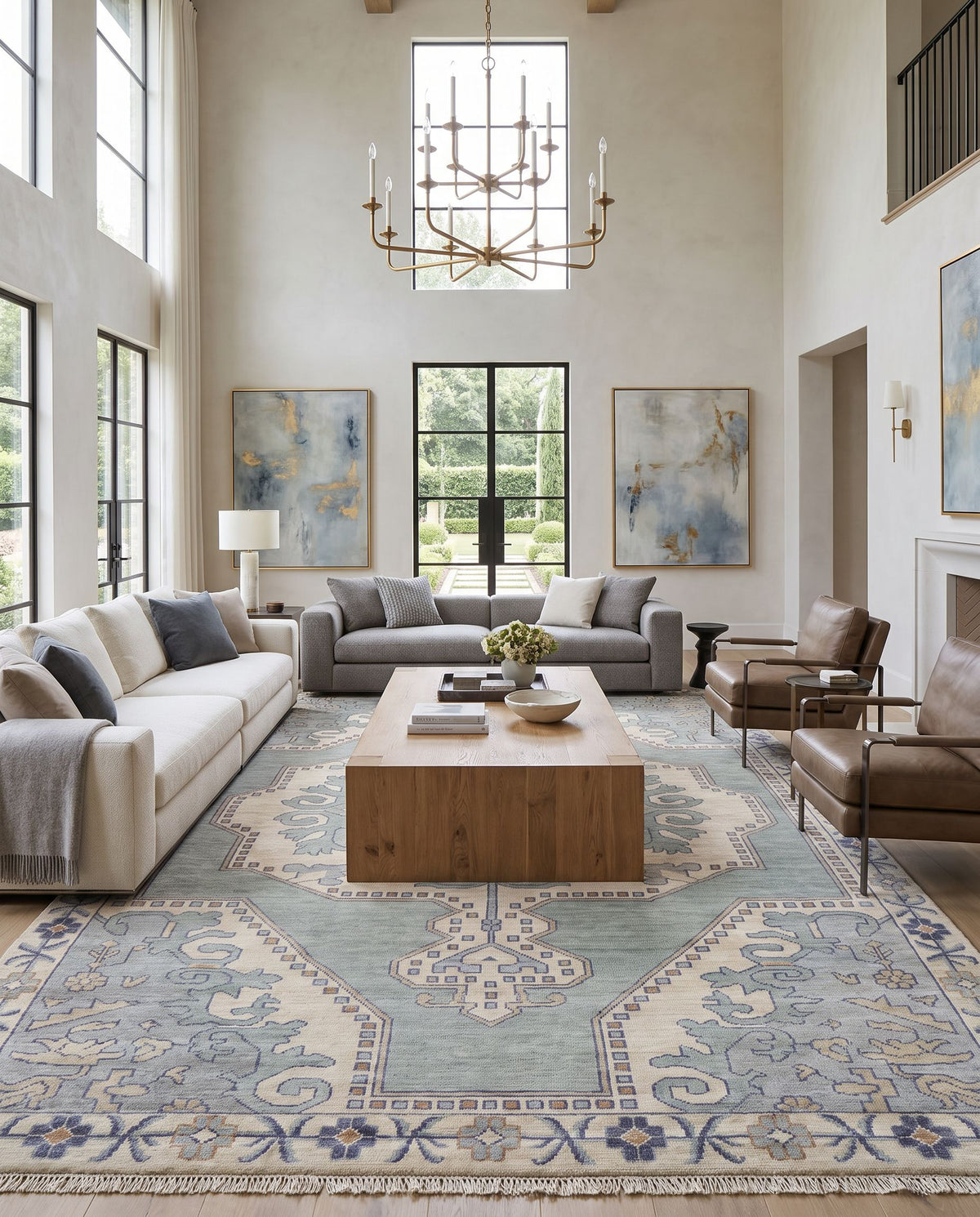 Cappadocia CPP-5031 Hand Knotted Rug as the centerpiece of a bright luxury living room — a hand knotted traditional area rug in denim, ivory, light sage and olive tones