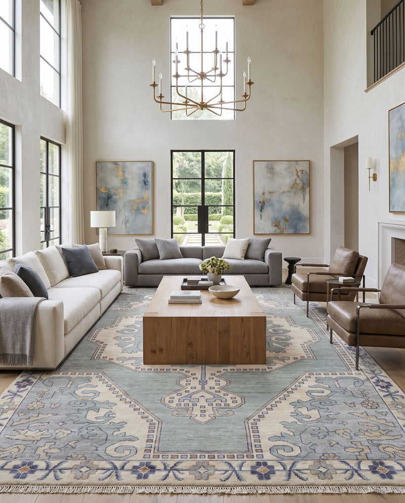 Cappadocia CPP-5031 Hand Knotted Rug as the centerpiece of a bright luxury living room — a hand knotted traditional area rug in denim, ivory, light sage and olive tones