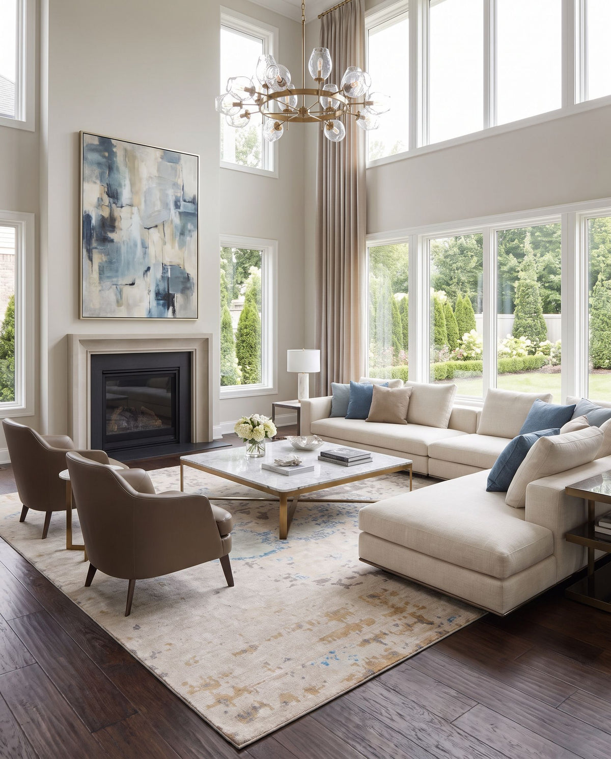 Ephemeral EPH-1000 Hand Knotted Rug as the centerpiece of a bright luxury living room — a hand knotted modern area rug in light blue, light sage, wheat and tan tones