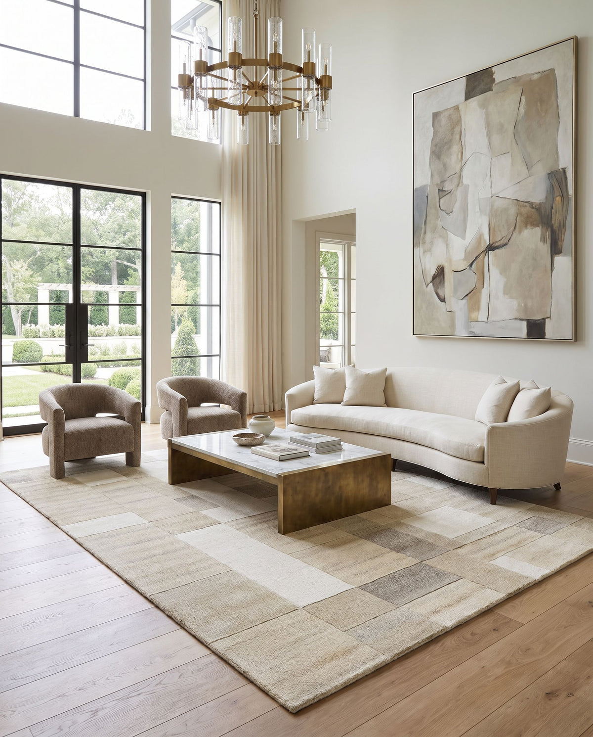 Forum FM-7246 Hand Tufted Rug as the centerpiece of a bright luxury living room — a hand tufted modern area rug in ivory, sandstone, taupe and beige tones