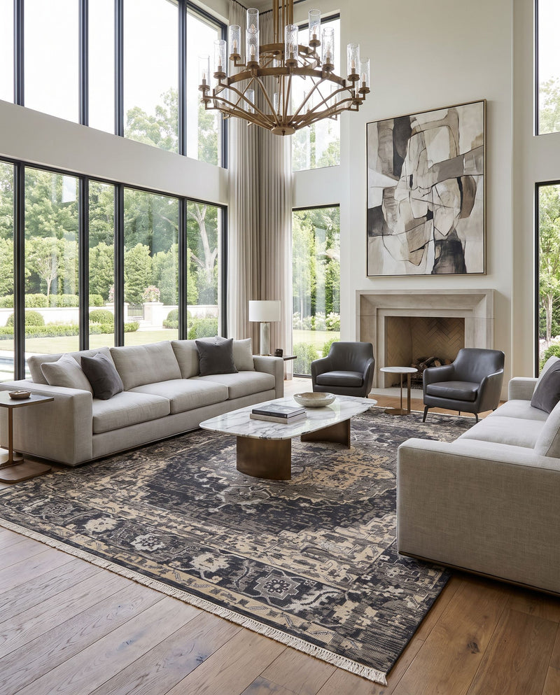 Festival FVL-1009 Hand Knotted Rug as the centerpiece of a bright luxury living room — a hand knotted traditional area rug in black, charcoal, medium gray and taupe tones