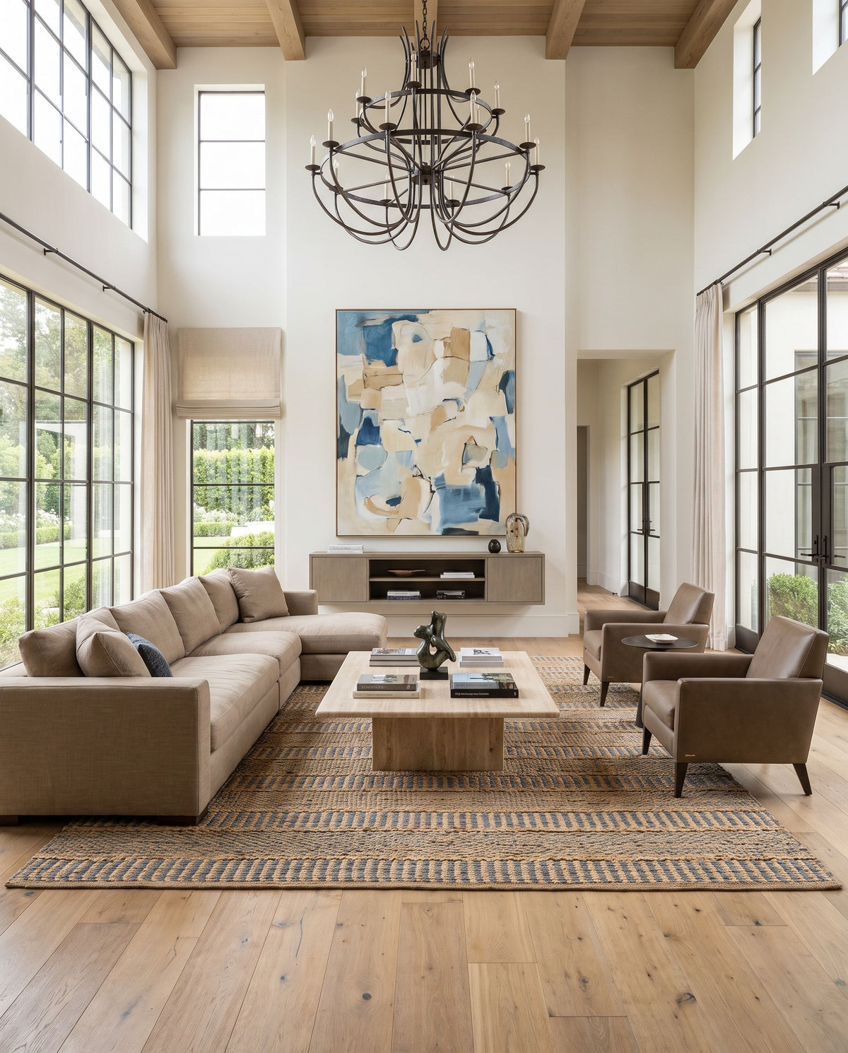 Aria IAA-1000 Hand Woven Rug as the centerpiece of a bright luxury living room — a hand woven transitional, traditional area rug in denim, beige and navy tones