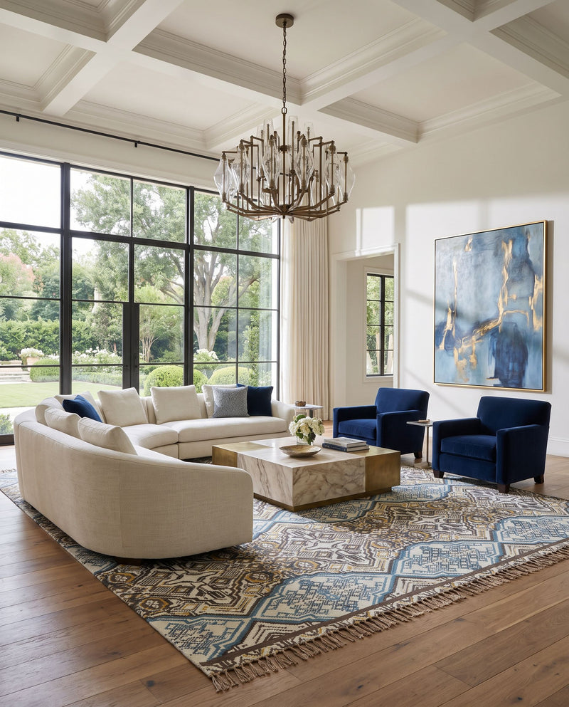 Idina IDI-8802 Hand Woven Rug as the centerpiece of a bright luxury living room — a hand woven modern area rug in charcoal, blue, mustard and dark brown tones