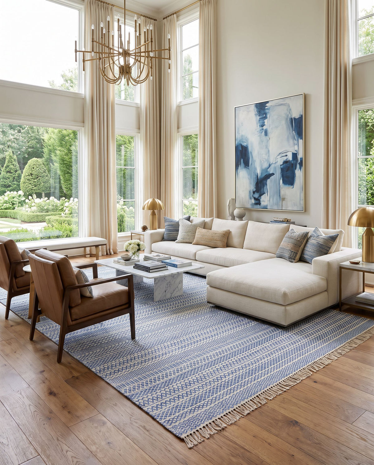 Idina II IDN-8000 Hand Woven Rug as the centerpiece of a bright luxury living room — a hand woven cottage area rug in blue and cream tones
