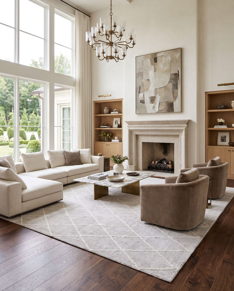 Jaque JAQ-4002 Hand Knotted Rug as the centerpiece of a bright luxury living room — a hand knotted modern area rug in light gray and off-white tones