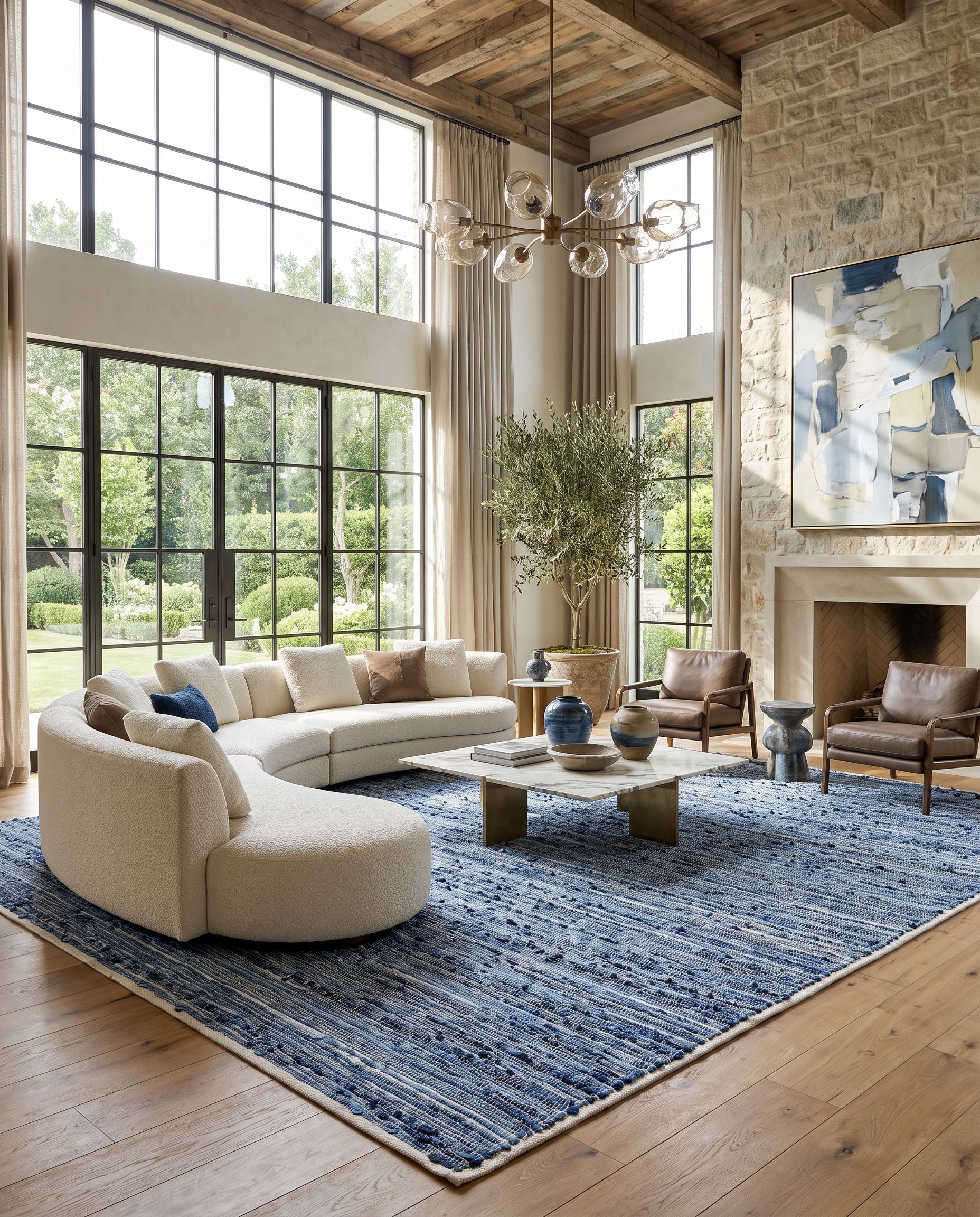 Jean JEA-2312 Hand Woven Rug as the centerpiece of a bright luxury living room — a hand woven modern area rug in denim blue, slate gray, charcoal and sky blue tones