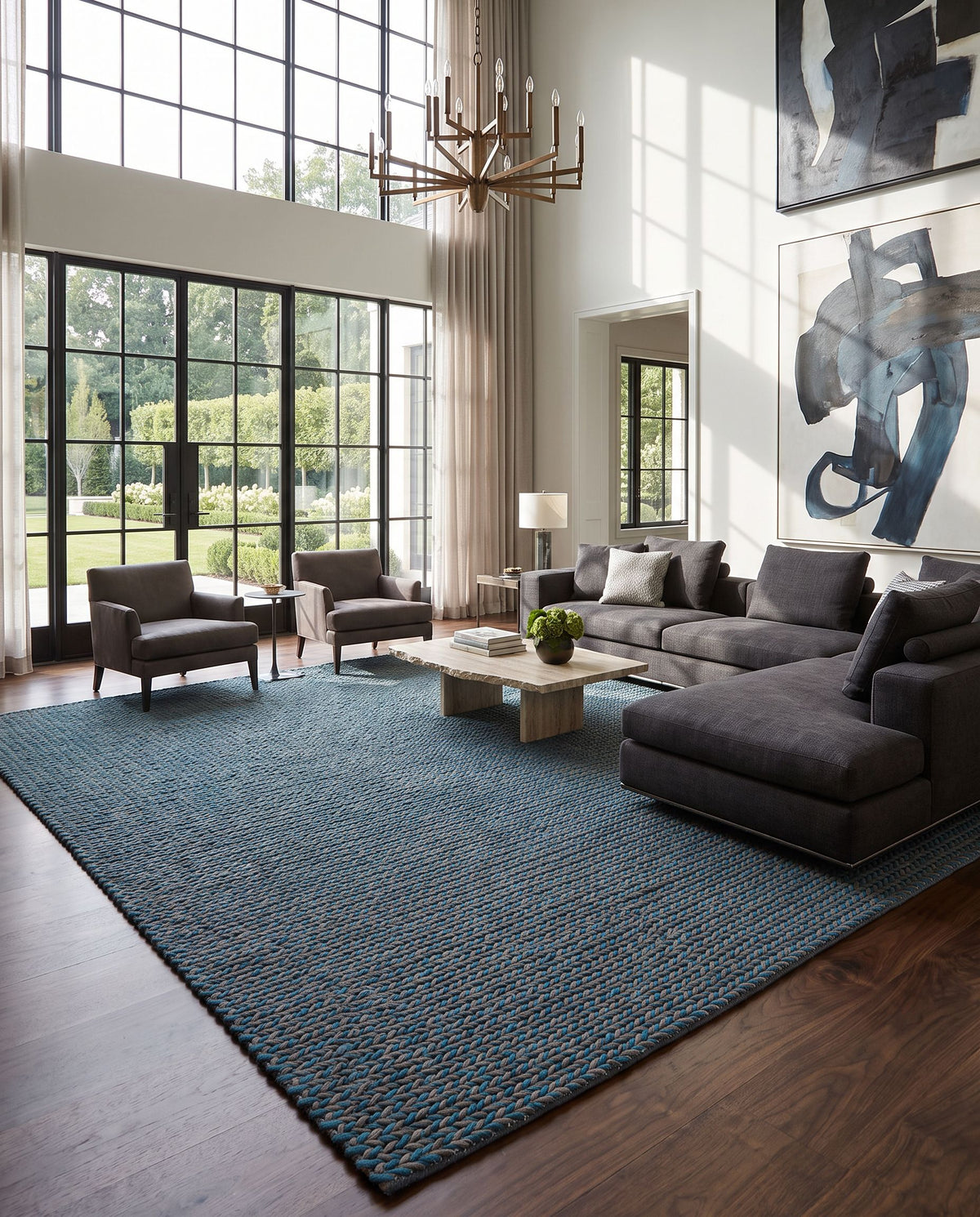 Juno JNO-1004 Hand Woven Rug as the centerpiece of a bright luxury living room — a hand woven cottage area rug in deep teal and dark brown tones