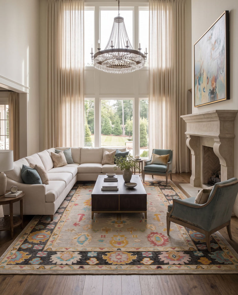 Kars KSA-2300 Hand Knotted Rug as the centerpiece of a bright luxury living room — a hand knotted traditional area rug in black, light blue, rose and pale pink tones