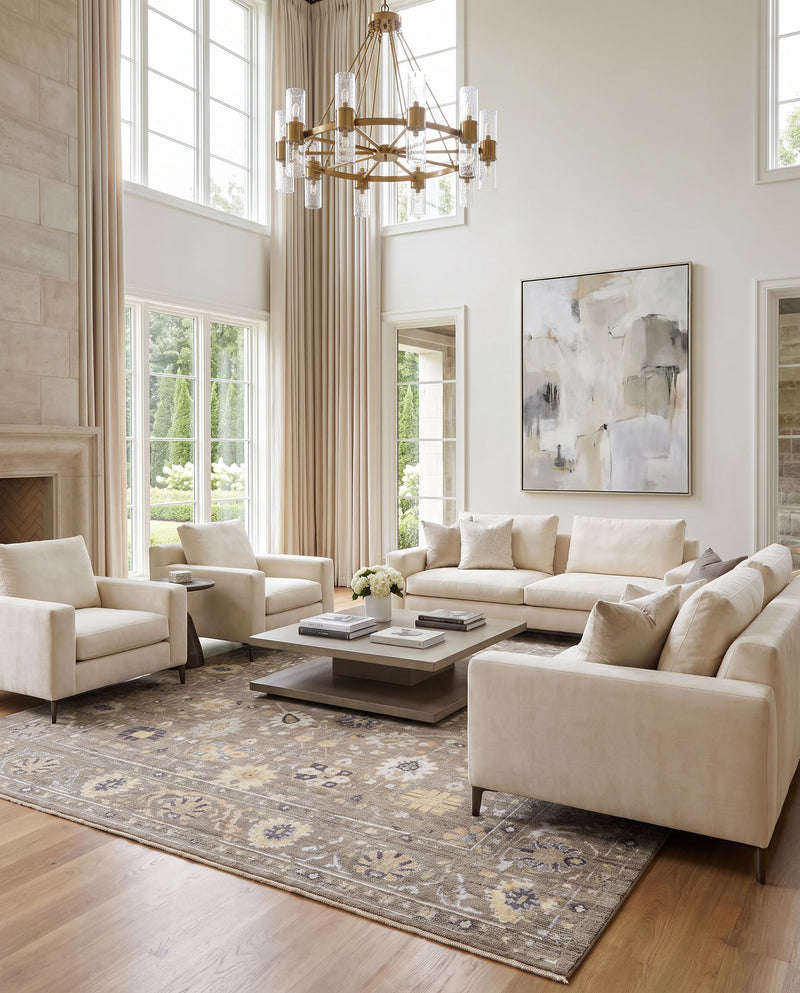 Kushal KUS-2305 Hand Knotted Rug as the centerpiece of a bright luxury living room — a hand knotted traditional area rug in charcoal, pale blue, wheat and dusty coral tones