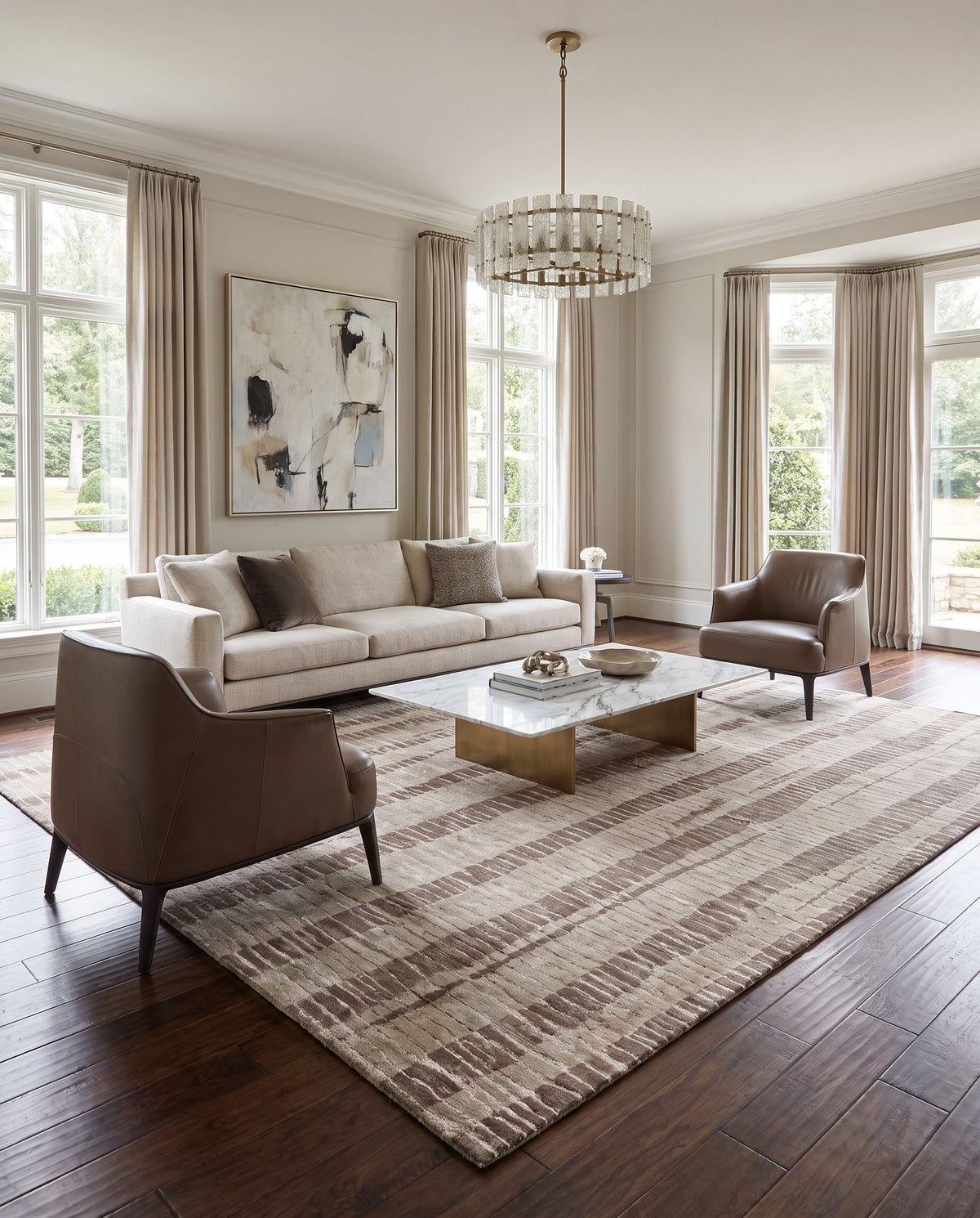 Luminous LMN-3023 Hand Knotted Rug styled in an elegant designer living room — hand knotted modern area rug in dark brown, taupe and light beige tones