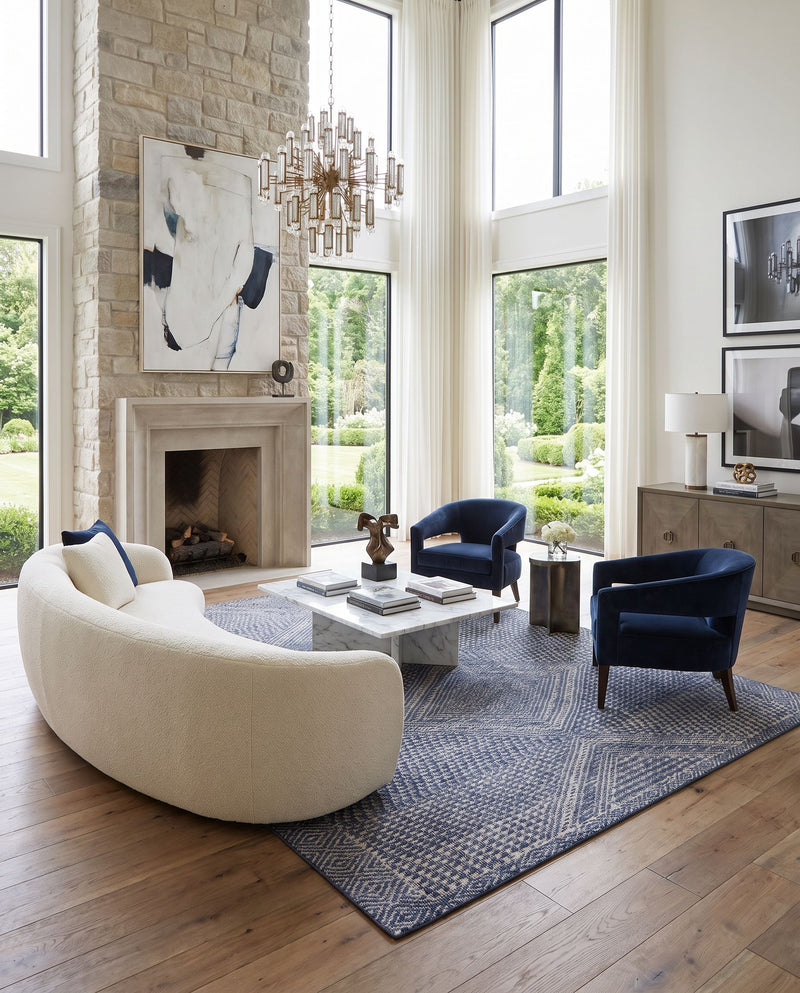 Livorno LVN-2304 Hand Knotted Rug as the centerpiece of a bright luxury living room — a hand knotted global area rug in dark blue, white and charcoal tones