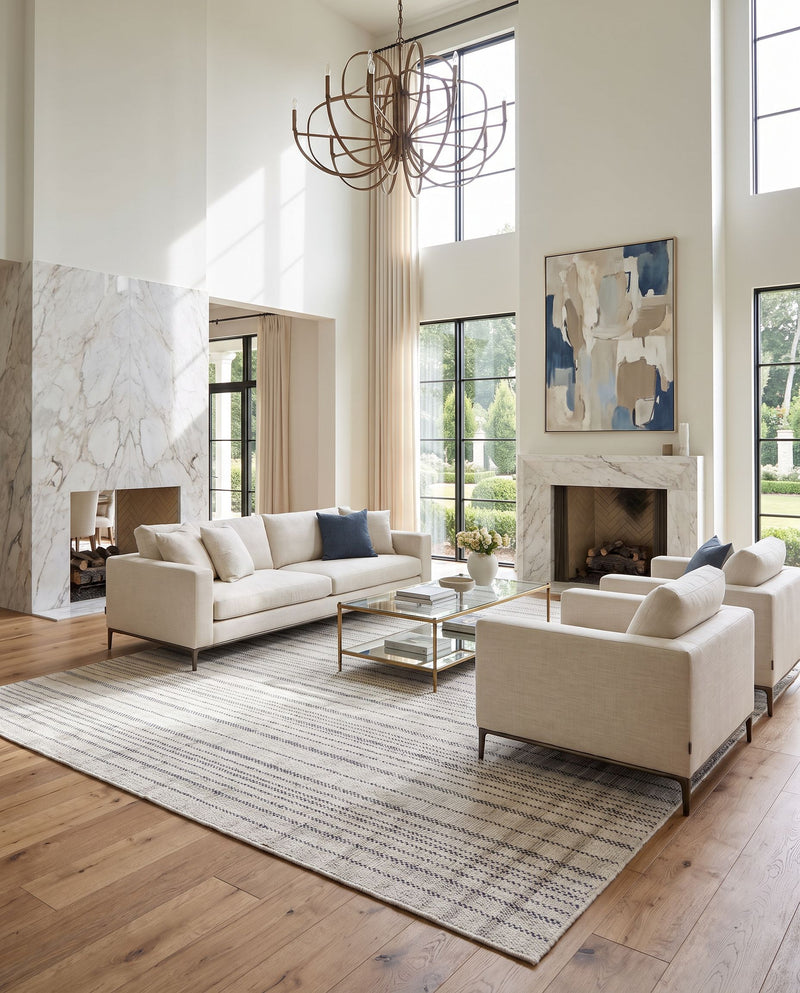 Mardin MDI-2339 Hand Woven Rug as the centerpiece of a bright luxury living room — a hand woven cottage area rug in ivory, charcoal and slate gray tones
