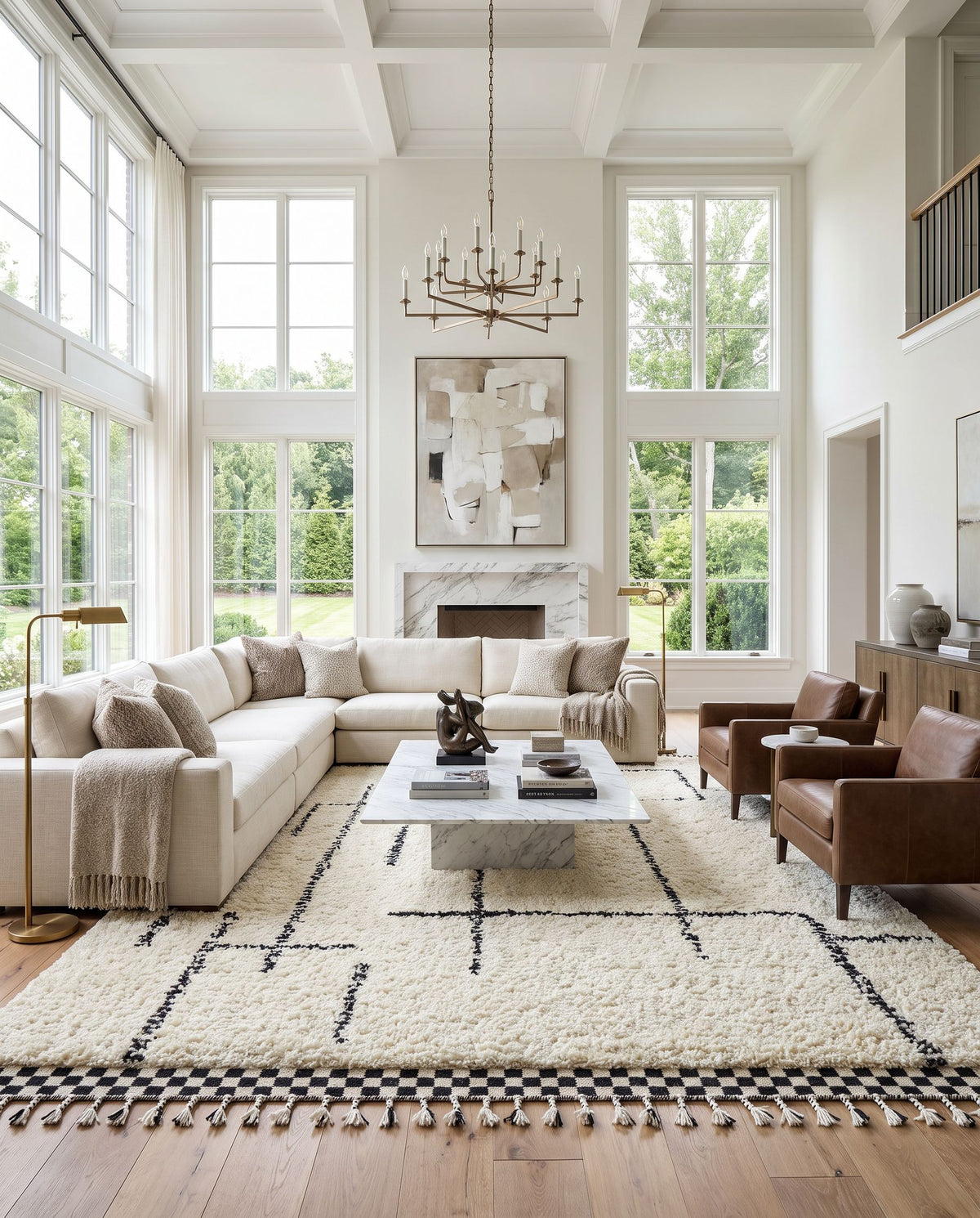 Mirela MMI-2300 Hand Woven Rug as the centerpiece of a bright luxury living room — a hand woven transitional, bohemian area rug in ivory, charcoal and jet black tones