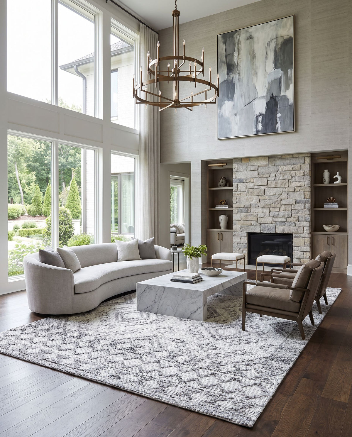 Napoli NPO-2305 Hand Woven Rug as the centerpiece of a bright luxury living room — a hand woven global area rug in light gray, light slate, white and black tones