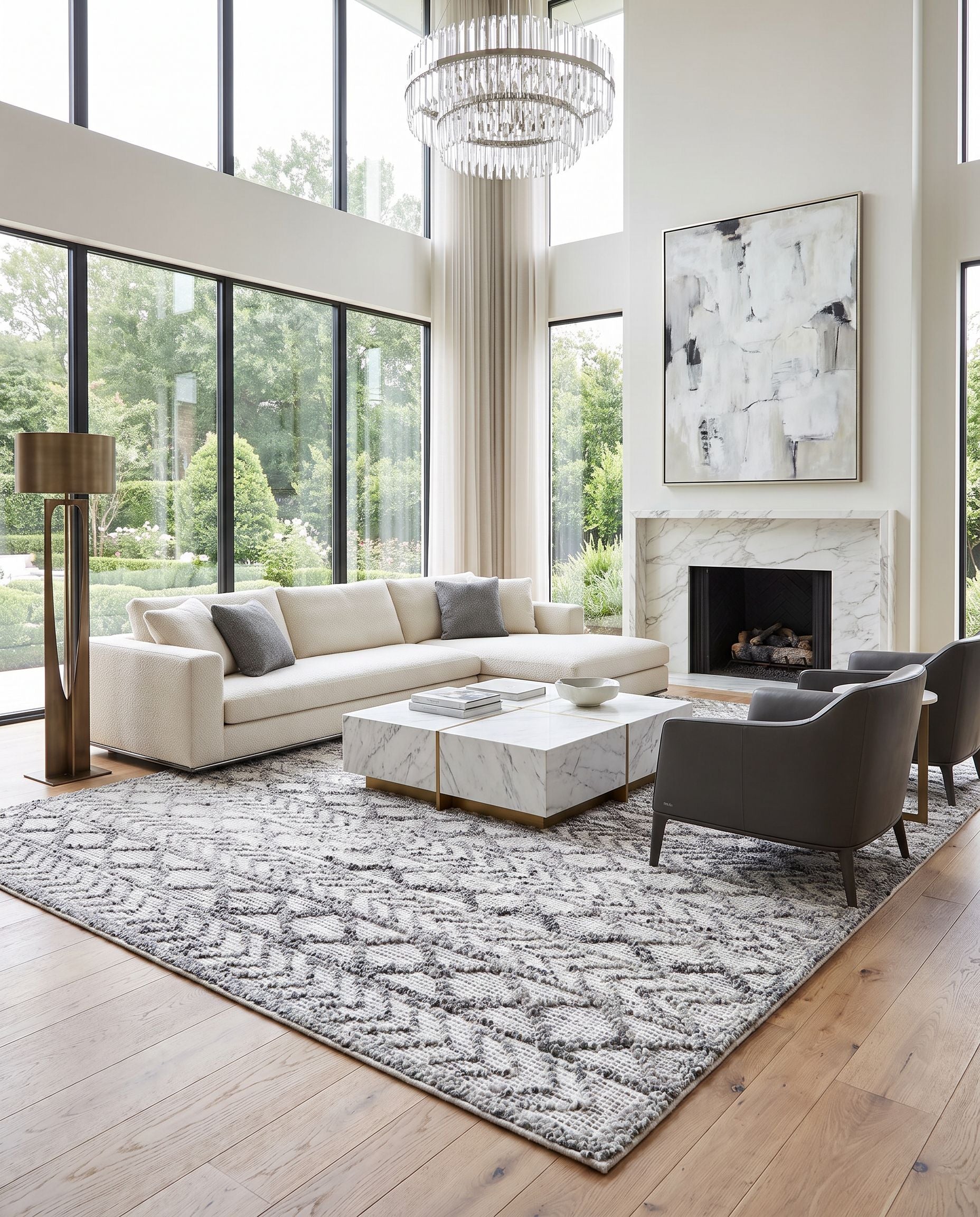 Napoli NPO-2311 Hand Woven Rug as the centerpiece of a bright luxury living room — a hand woven global area rug in light gray, light slate, white and black tones
