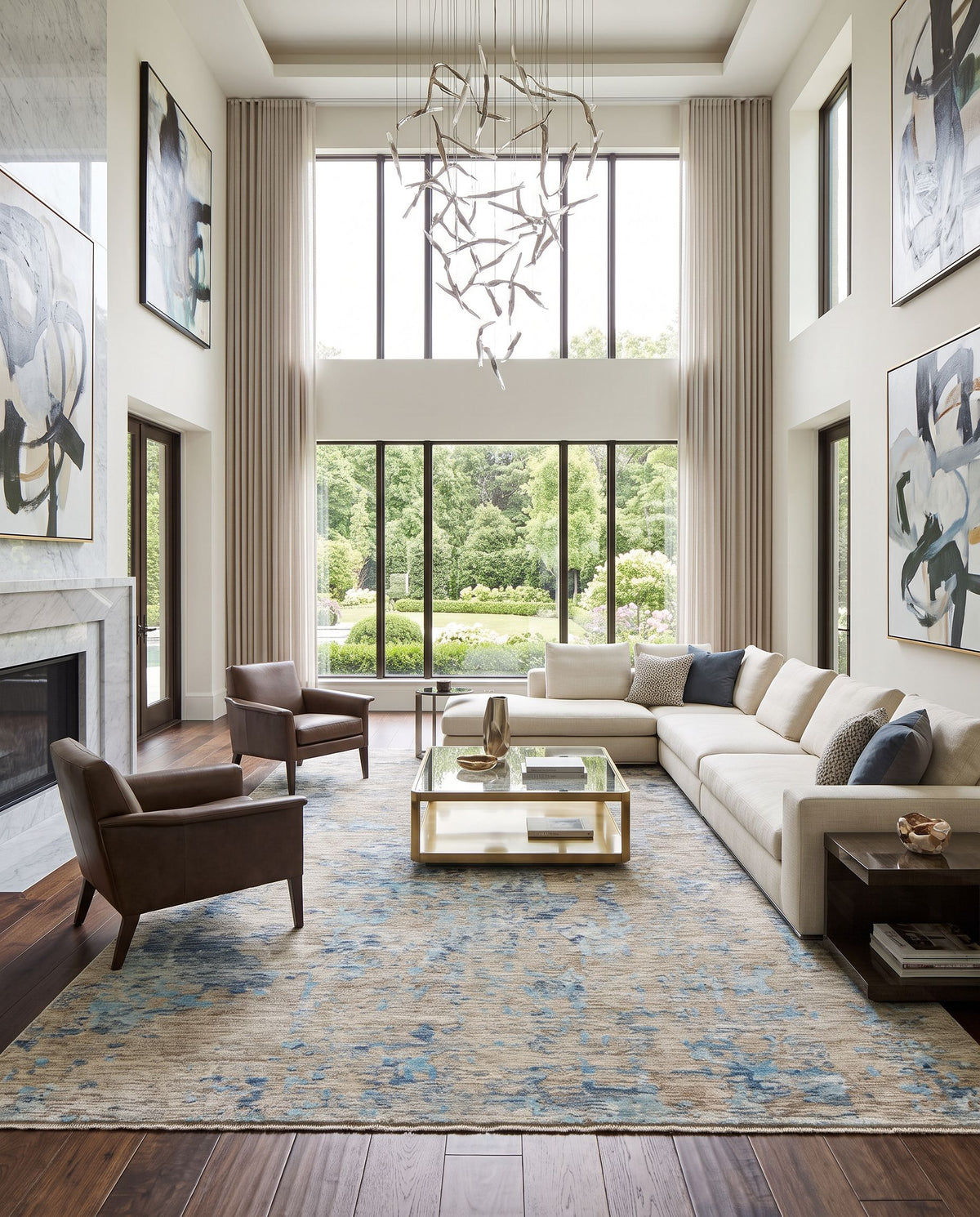 Ocean OCE-2301 Hand Knotted Rug as the centerpiece of a bright luxury living room — a hand knotted modern area rug in blue, ice blue, taupe and light gray tones