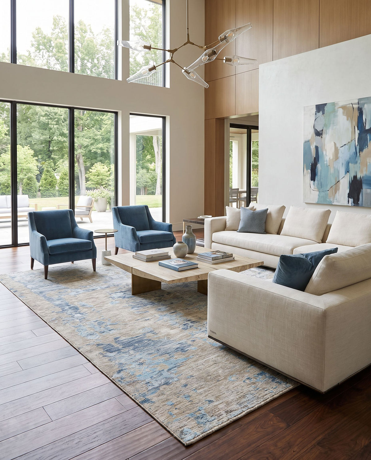 Ocean OCE-2301 Hand Knotted Rug styled in an elegant designer living room — hand knotted modern area rug in blue, ice blue, taupe and light gray tones