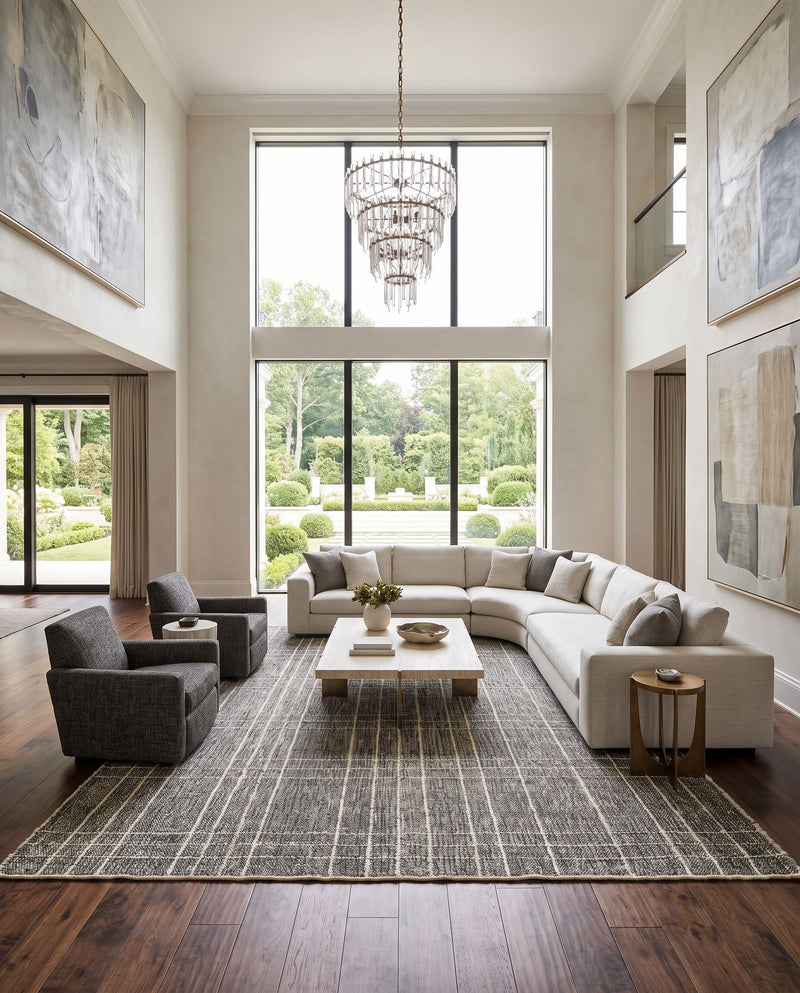 Otto OTT-2300 Hand Woven Rug as the centerpiece of a bright luxury living room — a hand woven modern area rug in black, ivory and gray tones