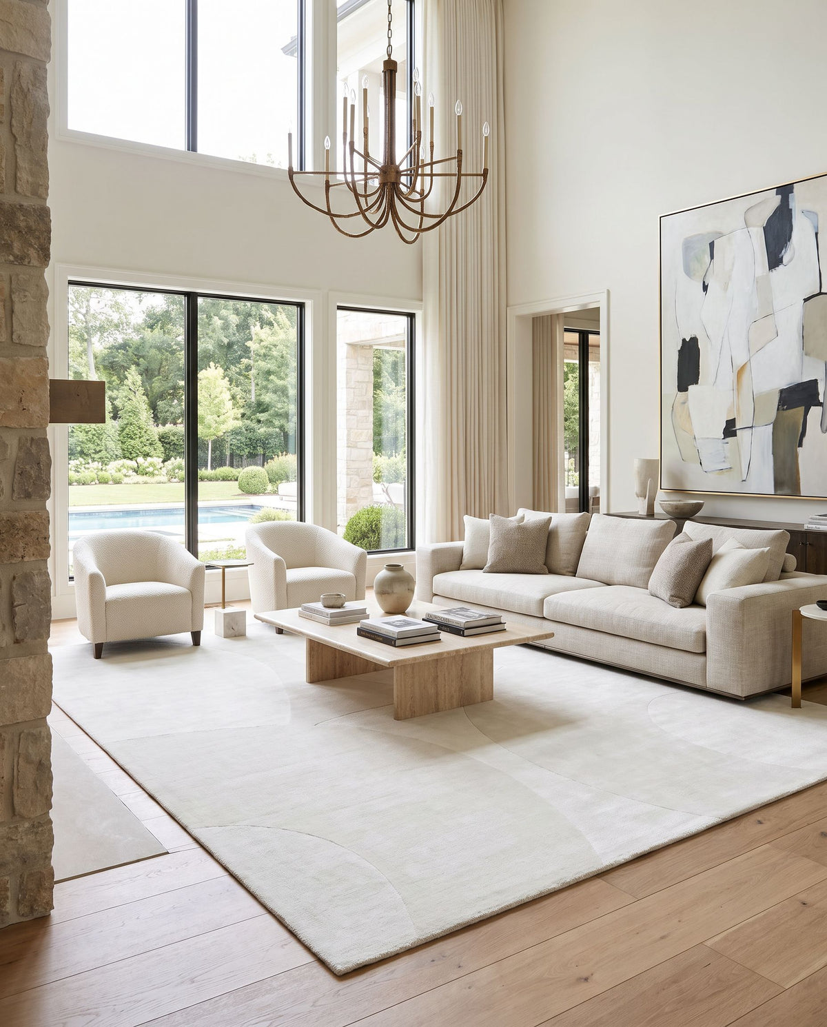Pier PIE-2308 Hand Loomed Rug as the centerpiece of a bright luxury living room — a hand loomed modern area rug in ivory, pearl and alabaster tones