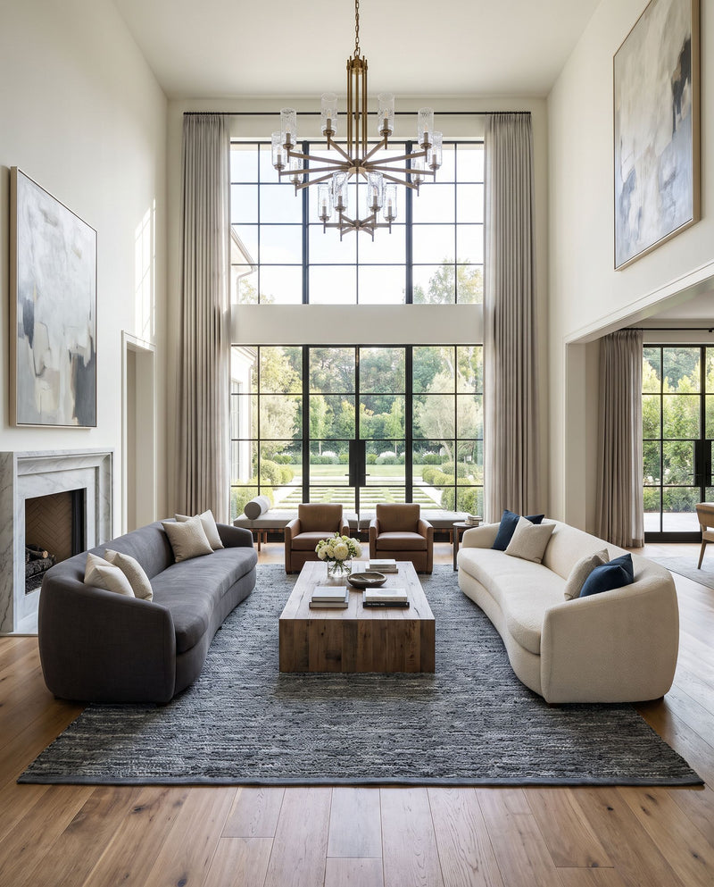 Porter POE-2300 Hand Woven Rug as the centerpiece of a bright luxury living room — a hand woven modern area rug in denim, blue and pale blue tones