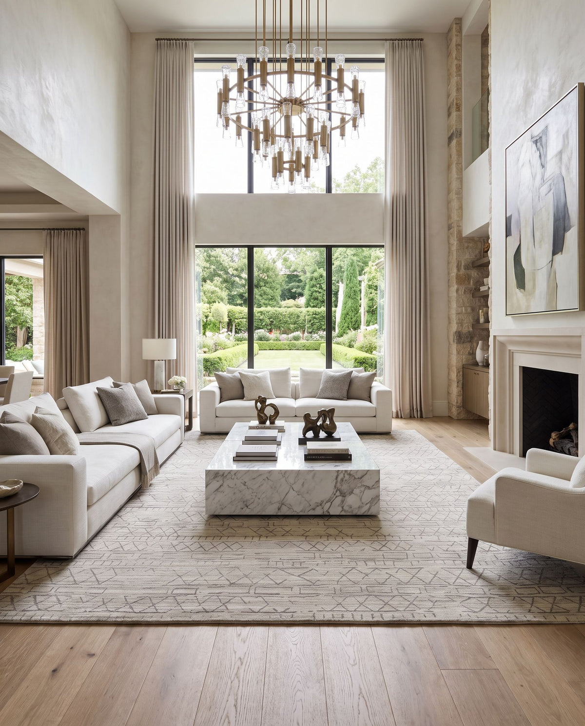 Pokhara POK-2300 Hand Loomed Rug as the centerpiece of a bright luxury living room — a hand loomed global area rug in taupe, ivory, light gray and gray tones