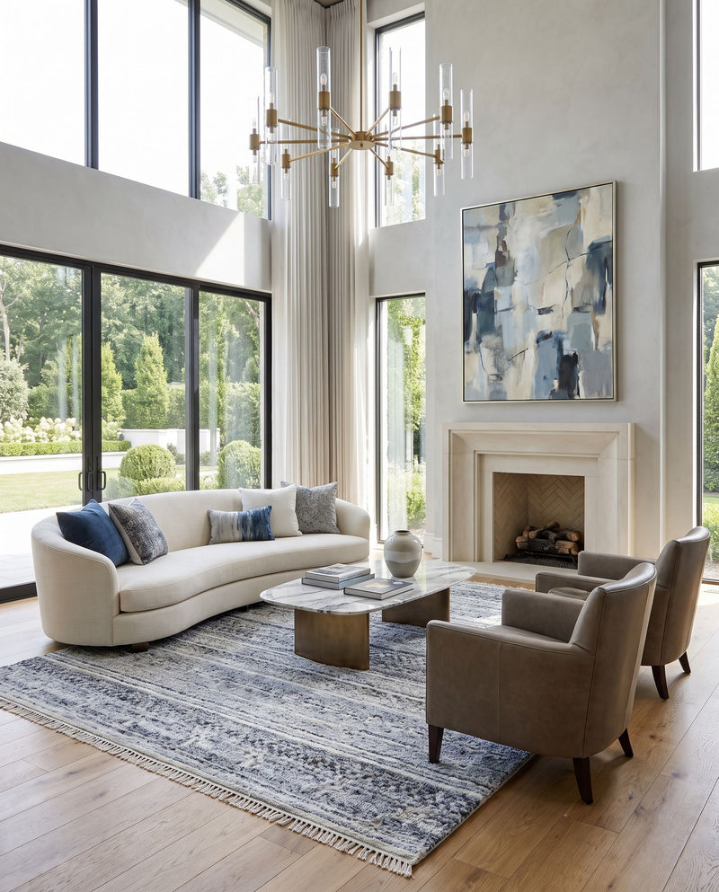 Pompei PPI-2306 Hand Knotted Rug as the centerpiece of a bright luxury living room — a hand knotted rustic area rug in dark blue, slate, black and brown tones