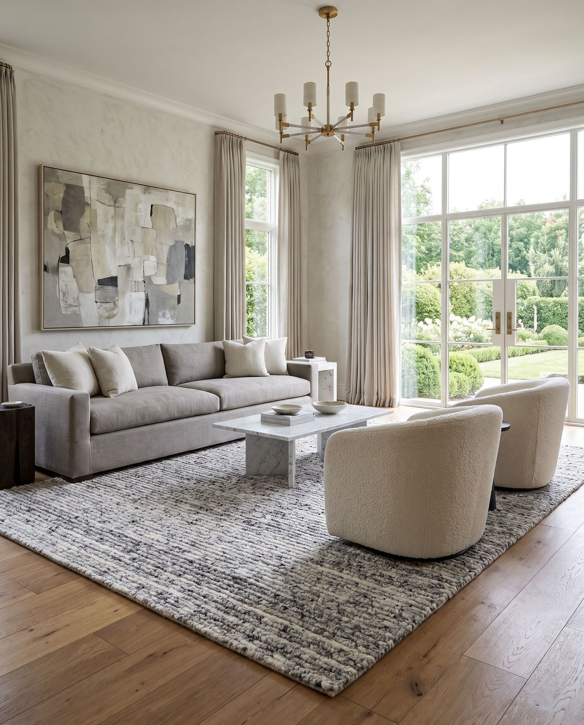 Ronin RIN-2300 Hand Loomed Rug styled in an elegant designer living room — hand loomed cottage area rug in charcoal, ash gray and ivory tones