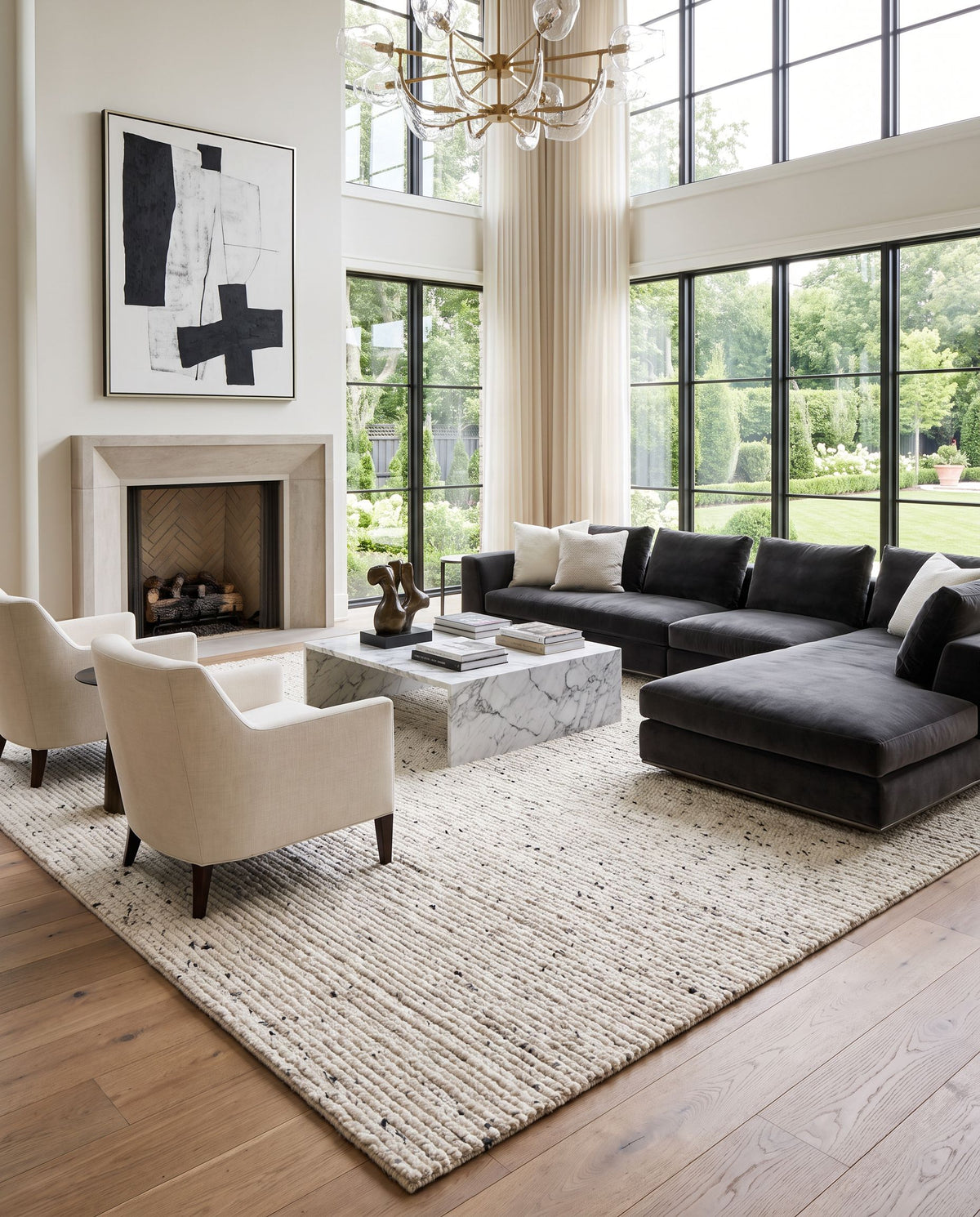Ronin RIN-2301 Hand Loomed Rug styled in an elegant designer living room — hand loomed cottage area rug in ivory, charcoal and slate gray tones