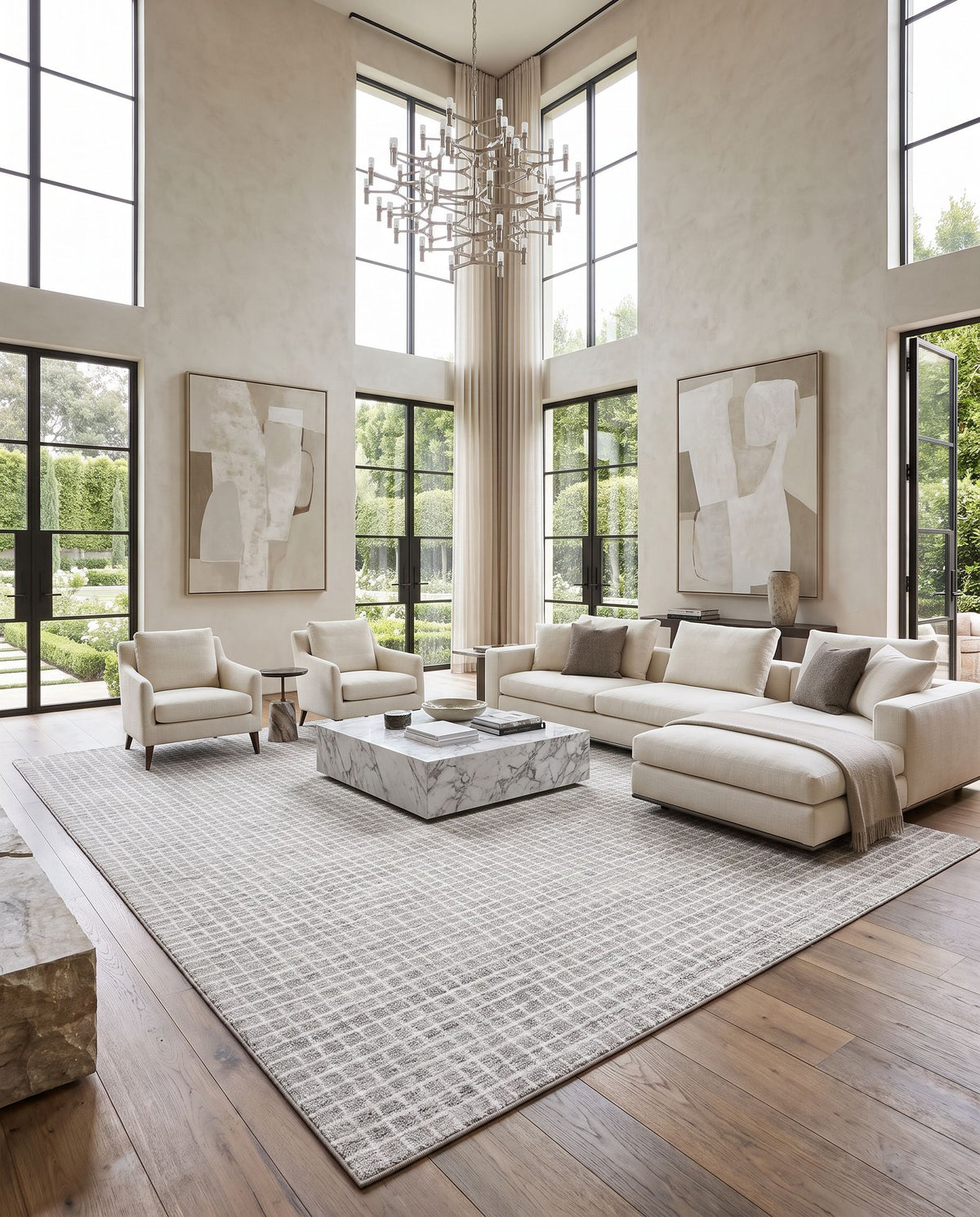 Ayvalik Hand Tufted Rug as the centerpiece of a bright luxury living room — a hand tufted area rug in ivory, dove gray, pearl and ash tones