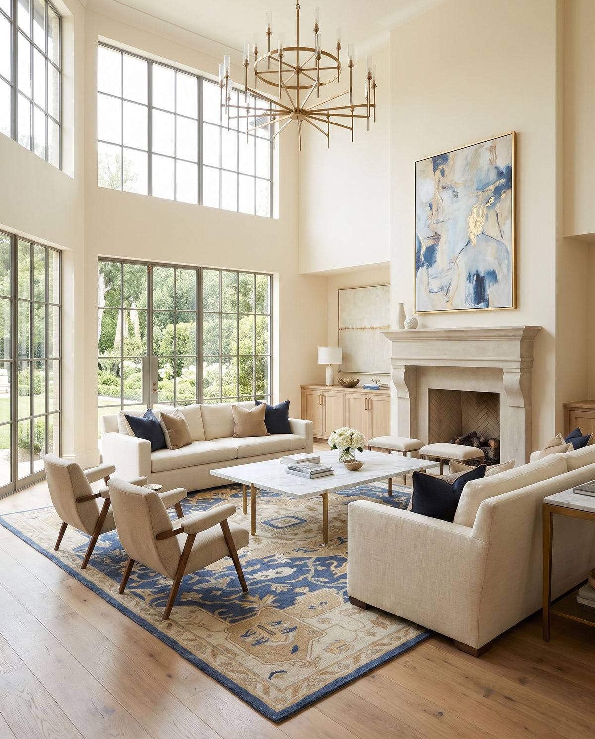 Borealis Hand Tufted Rug styled in an elegant designer living room — hand tufted traditional area rug in ink blue, light gray, taupe and medium gray tones