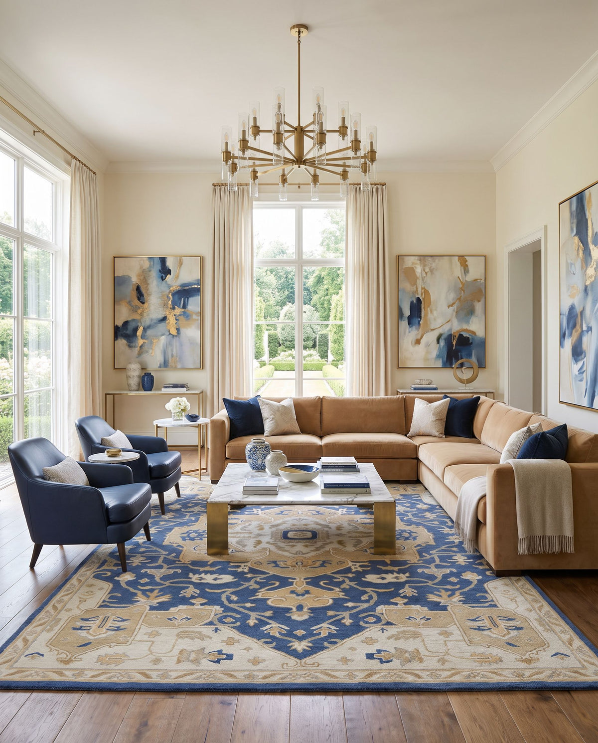 Borealis Hand Tufted Rug styled in an elegant designer living room — hand tufted traditional area rug in ink blue, light gray, taupe and medium gray tones
