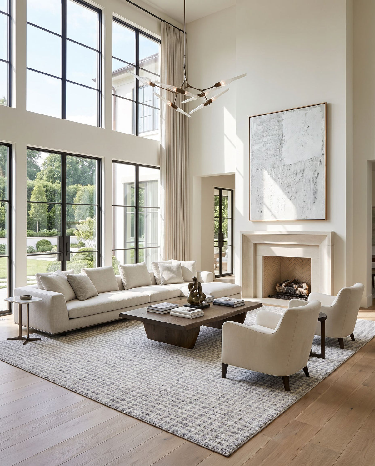 Divrigi Hand Tufted Rug as the centerpiece of a bright luxury living room — a hand tufted area rug in ivory, slate gray and pearl white tones