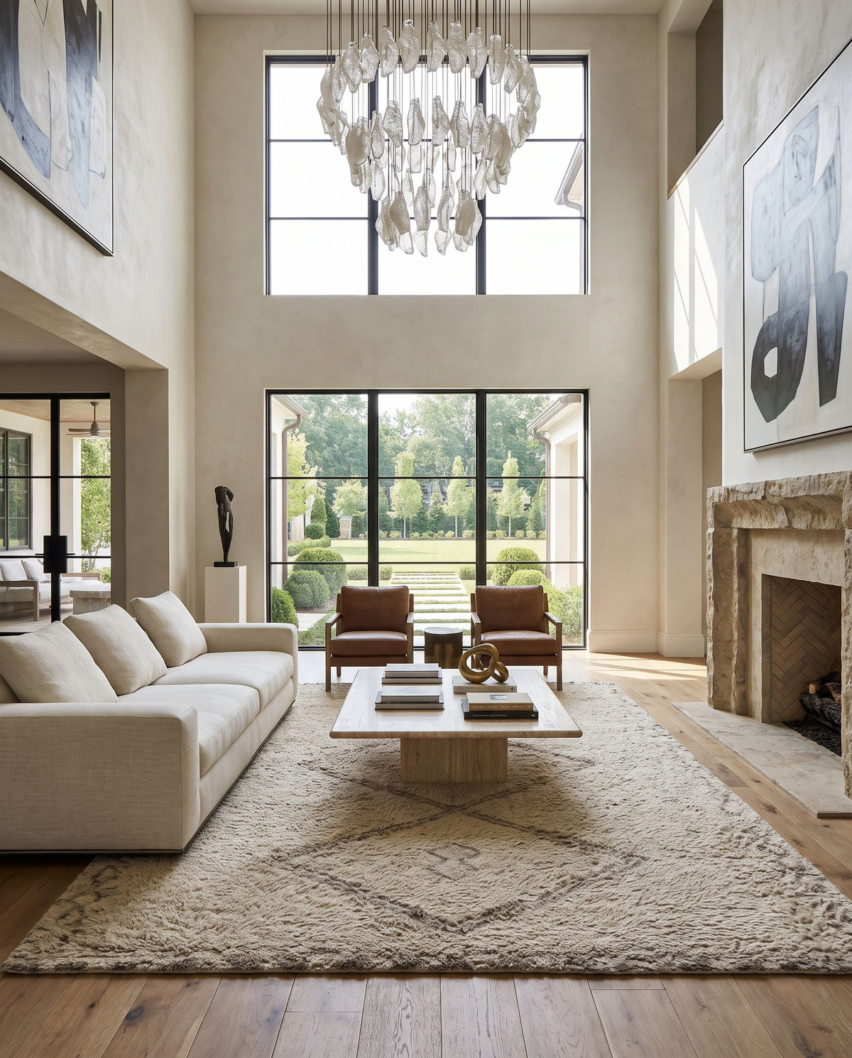 Kythira Hand Tufted Rug as the centerpiece of a bright luxury living room — a hand tufted global area rug in beige, taupe, sand and cream tones