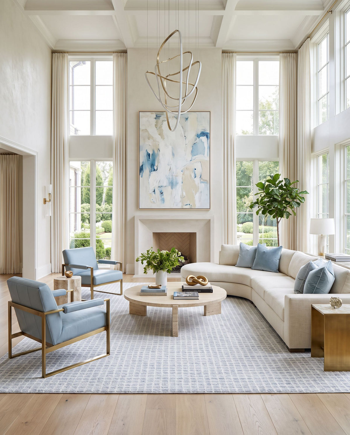 Mucur Hand Tufted Rug as the centerpiece of a bright luxury living room — a hand tufted area rug in powder blue, soft gray and frost white tones