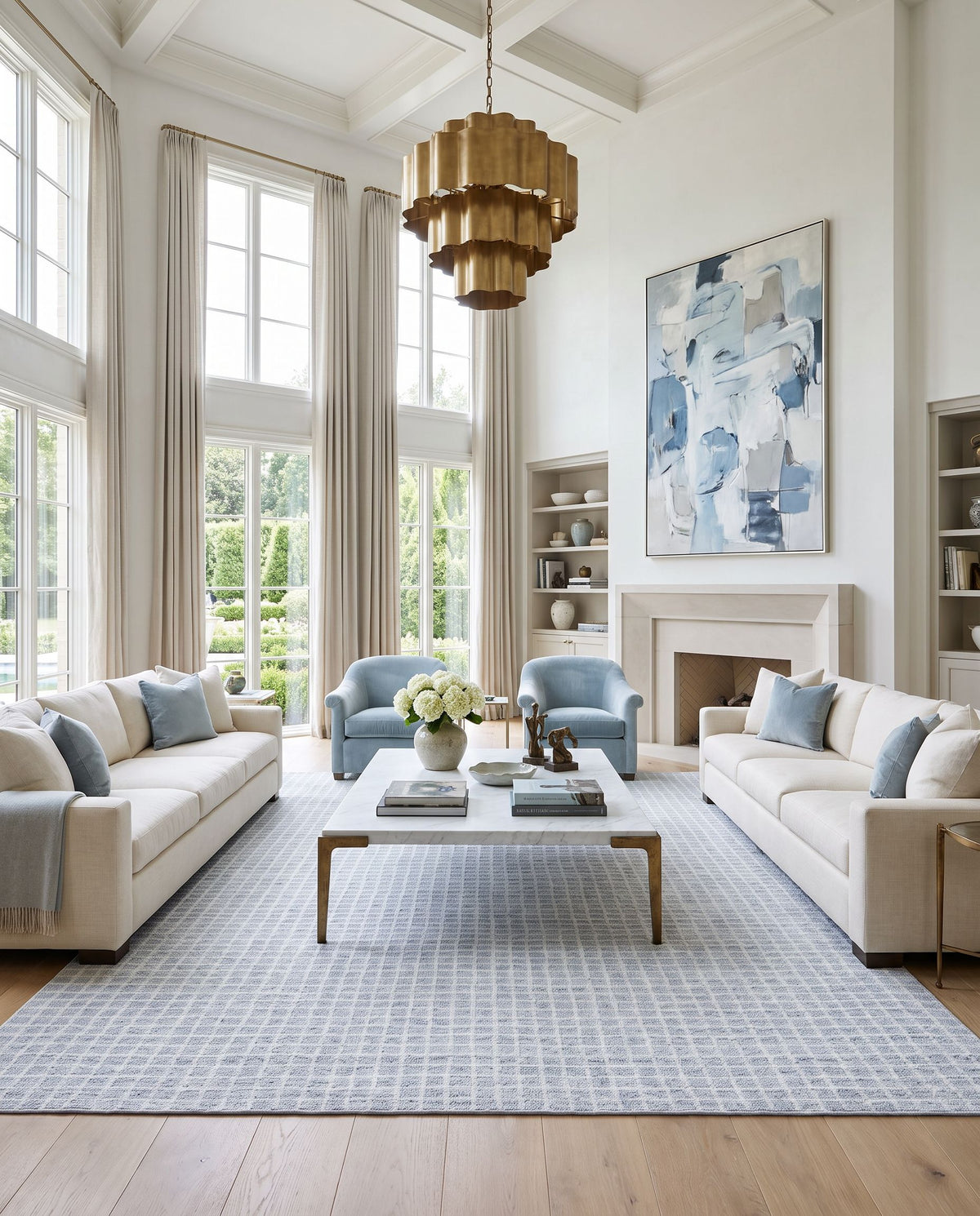 Mucur Hand Tufted Rug styled in an elegant designer living room — hand tufted area rug in powder blue, soft gray and frost white tones