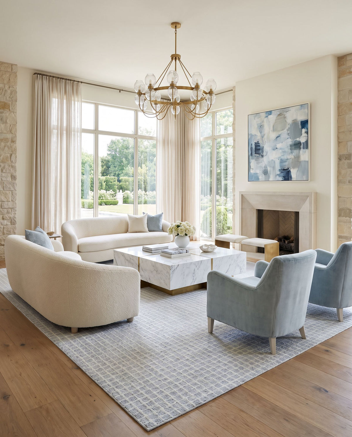 Mucur Hand Tufted Rug styled in an elegant designer living room — hand tufted area rug in powder blue, soft gray and frost white tones