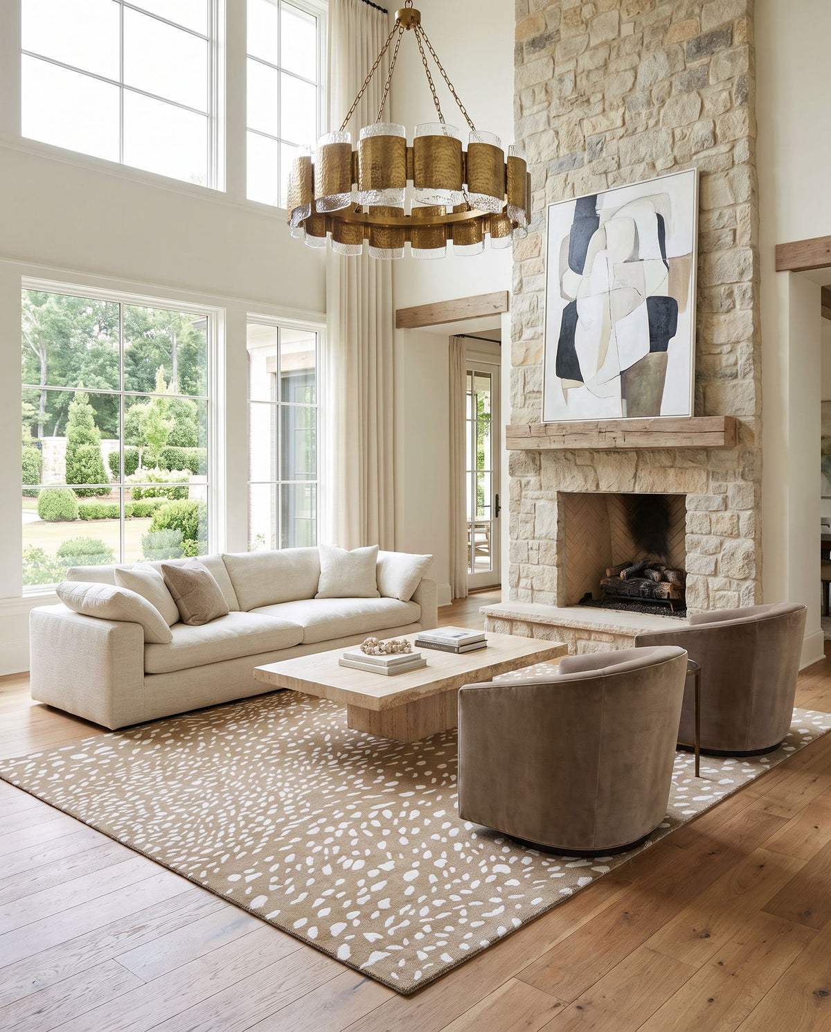 Orebro Hand Tufted Rug as the centerpiece of a bright luxury living room — a hand tufted modern area rug in light brown, tan and cream tones
