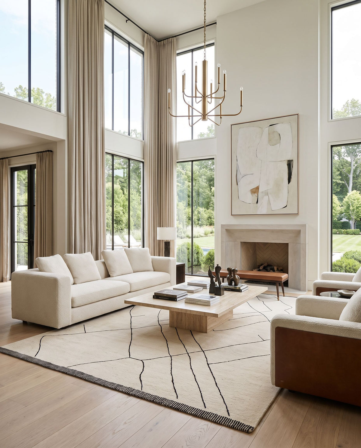 Ribe Hand Tufted Rug as the centerpiece of a bright luxury living room — a hand tufted global area rug in cream and black tones