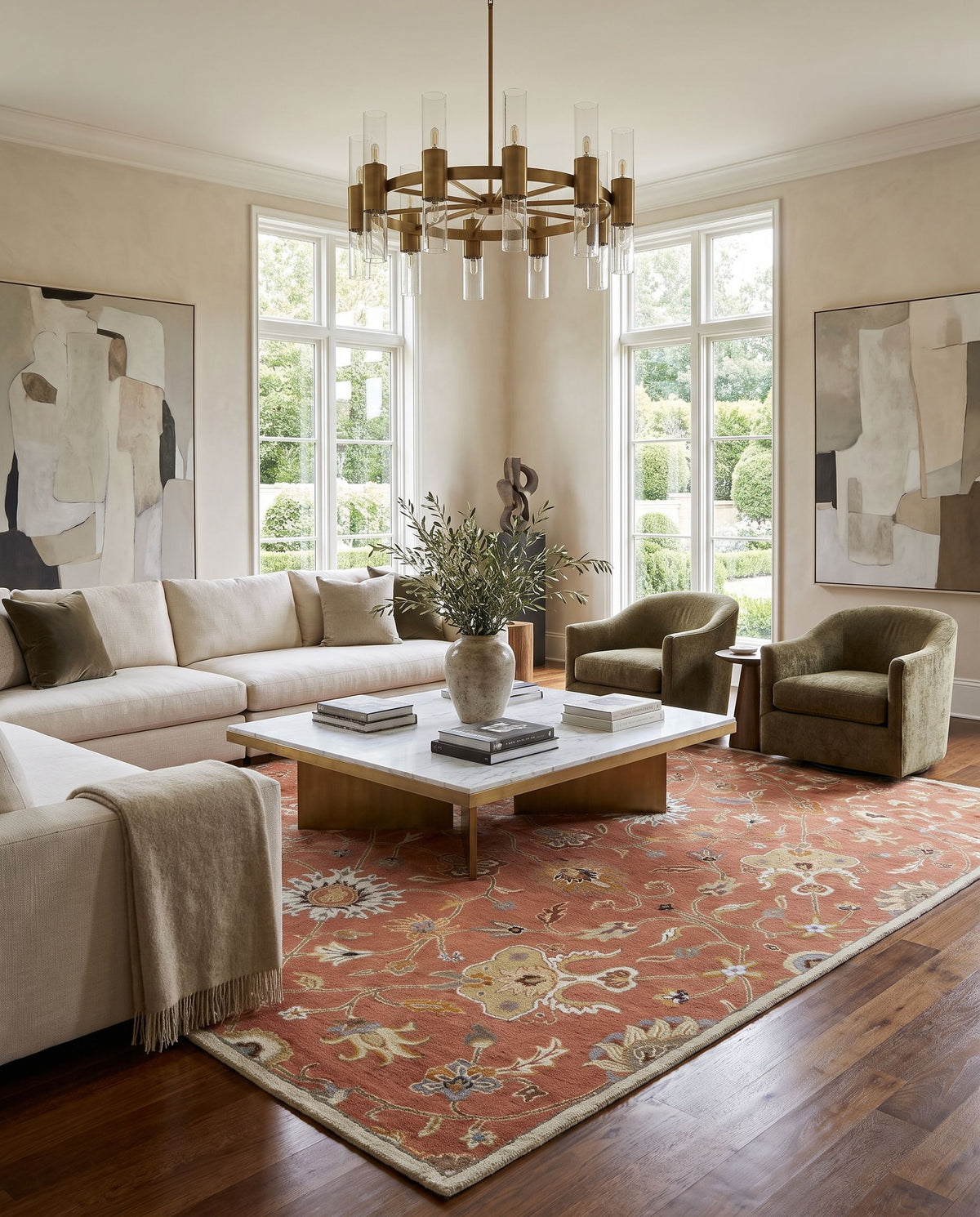 Solstice Hand Tufted Rug styled in an elegant designer living room — hand tufted traditional area rug in dusty pink, ivory, camel and sky blue tones