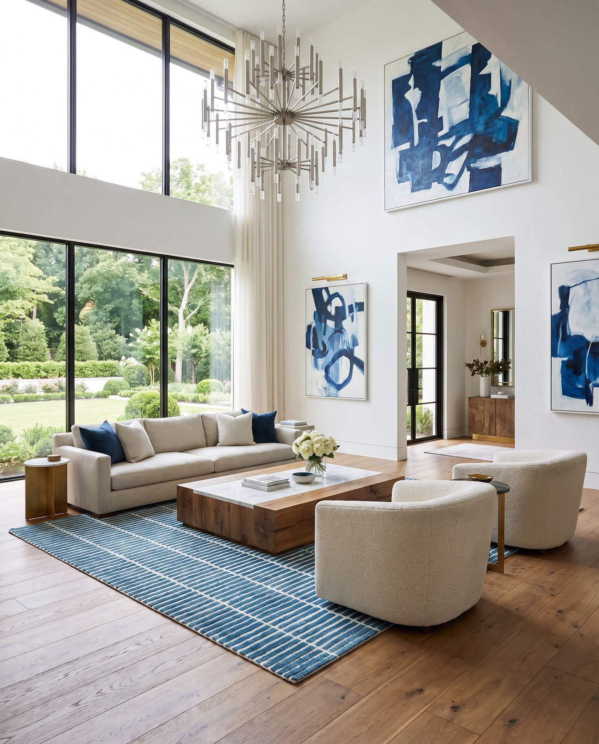 Tinos Hand Tufted Rug as the centerpiece of a bright luxury living room — a hand tufted modern area rug in warm neutral tones