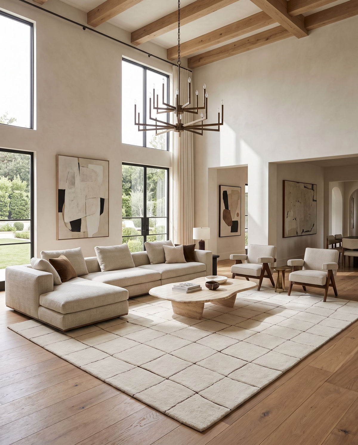 Tozlu Hand Tufted Rug as the centerpiece of a bright luxury living room — a hand tufted global area rug in ivory and charcoal tones
