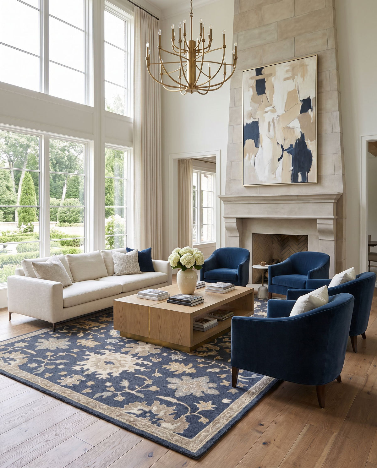 Viborg Hand Tufted Rug styled in an elegant designer living room — hand tufted traditional area rug in navy, brown, medium gray and light beige tones