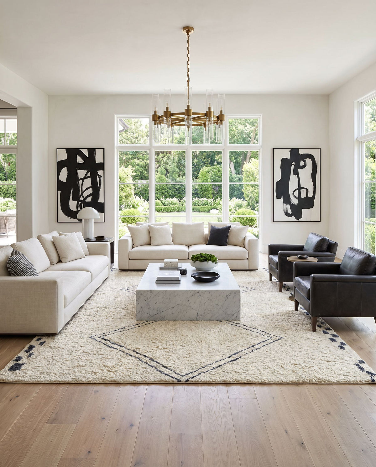Volos Hand Tufted Rug styled in an elegant designer living room — hand tufted global area rug in ivory and charcoal tones