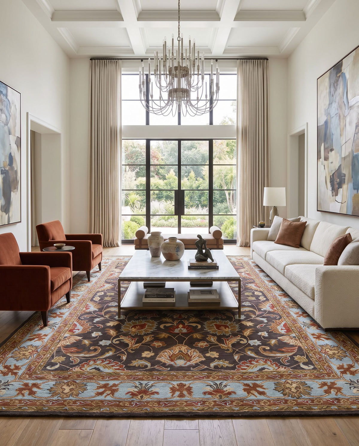 Zinnia Hand Tufted Rug as the centerpiece of a bright luxury living room — a hand tufted traditional area rug in charcoal, slate, burnt orange and tan tones