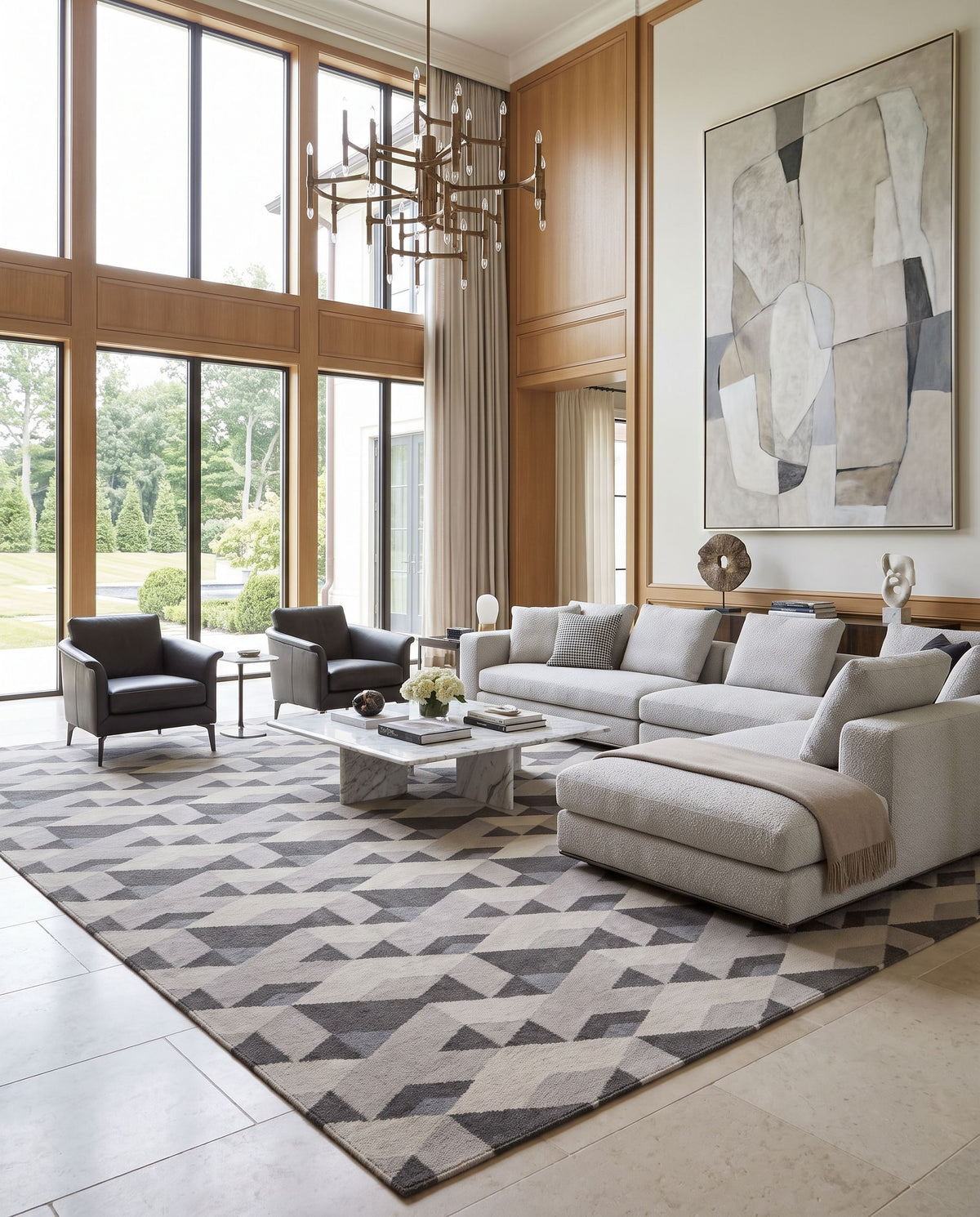 Rivington RVT-5017 Hand Woven Rug as the centerpiece of a bright luxury living room — a hand woven modern area rug in charcoal, light slate, gray and ivory tones