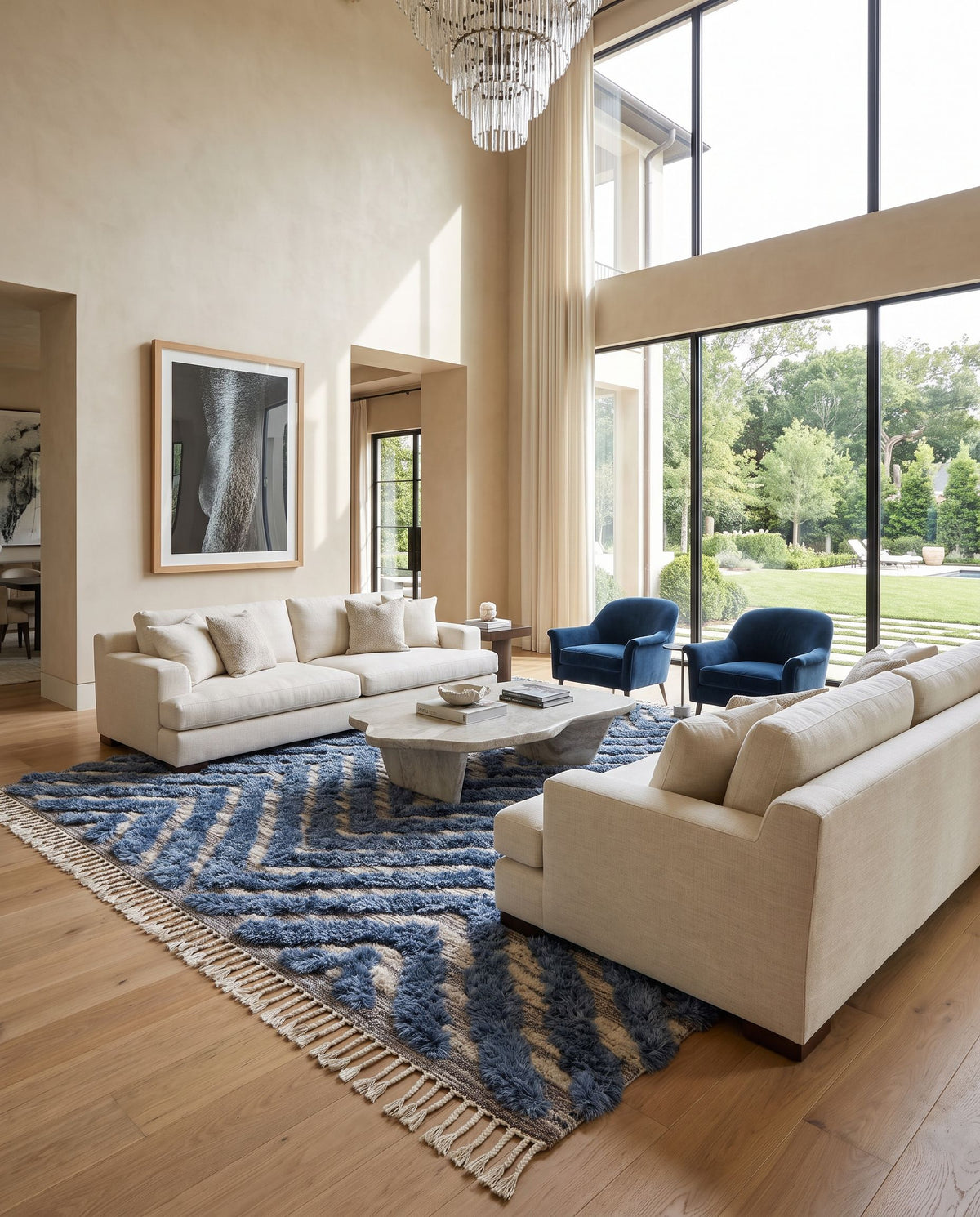 Sahara SAH-2304 Hand Knotted Rug as the centerpiece of a bright luxury living room — a hand knotted global area rug in charcoal, light beige, gray and blue tones