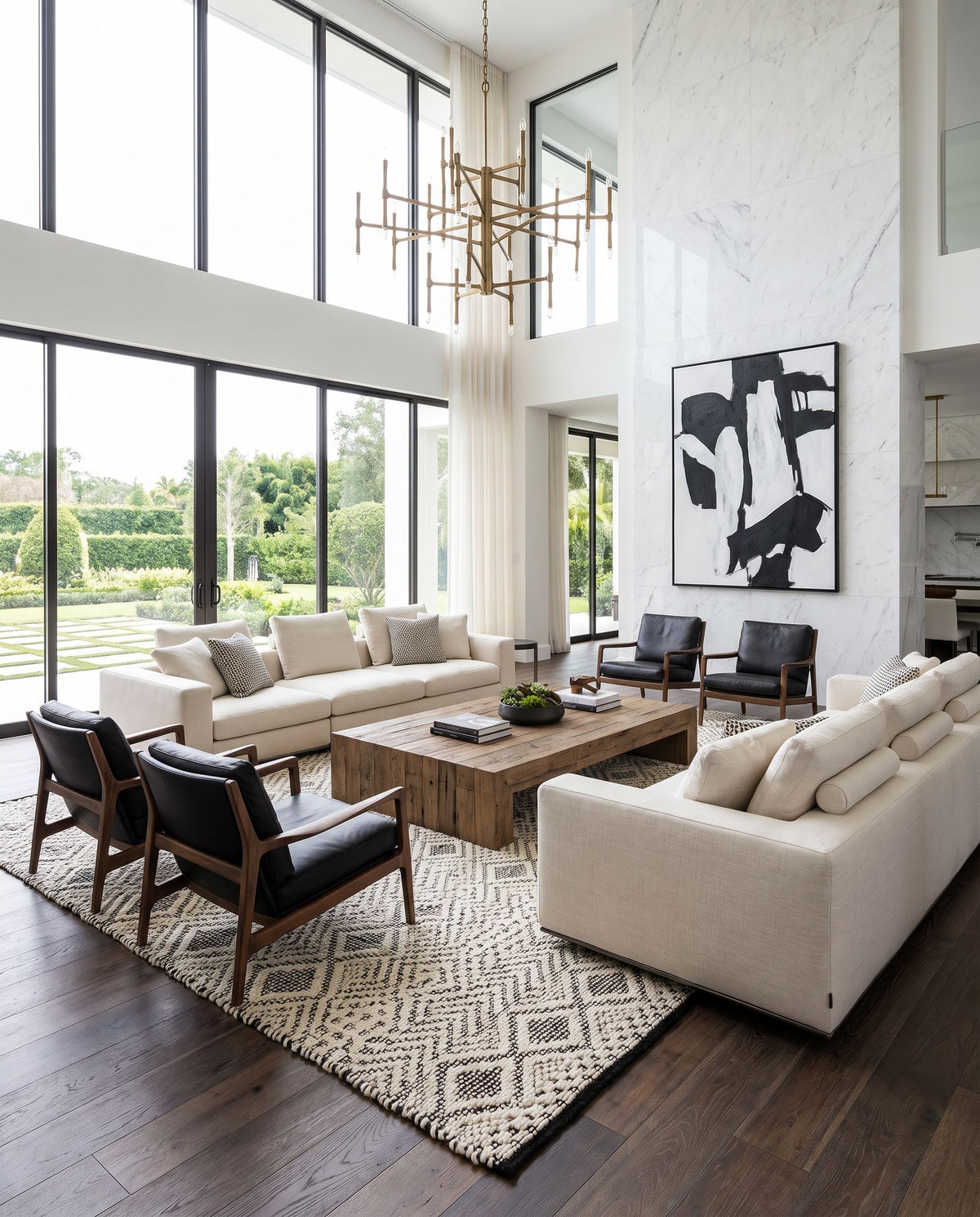 Santa Barbara SBB-2303 Hand Woven Rug as the centerpiece of a bright luxury living room — a hand woven global area rug in cream and black tones
