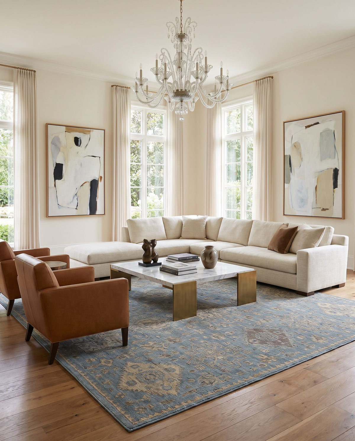 Smyrna SMY-2303 Hand Knotted Rug styled in an elegant designer living room — hand knotted traditional area rug in light blue, medium gray, beige and black tones