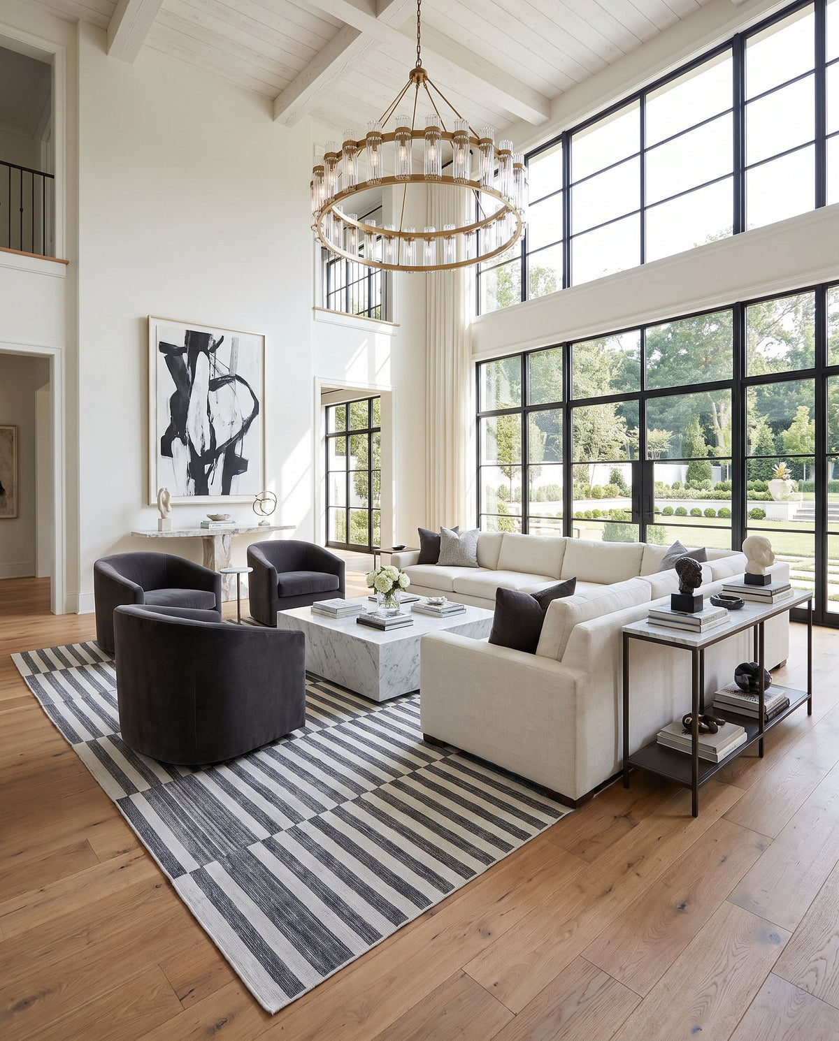 Santorini SNI-2300 Hand Loomed Rug as the centerpiece of a bright luxury living room — a hand loomed contemporary area rug in black and white tones