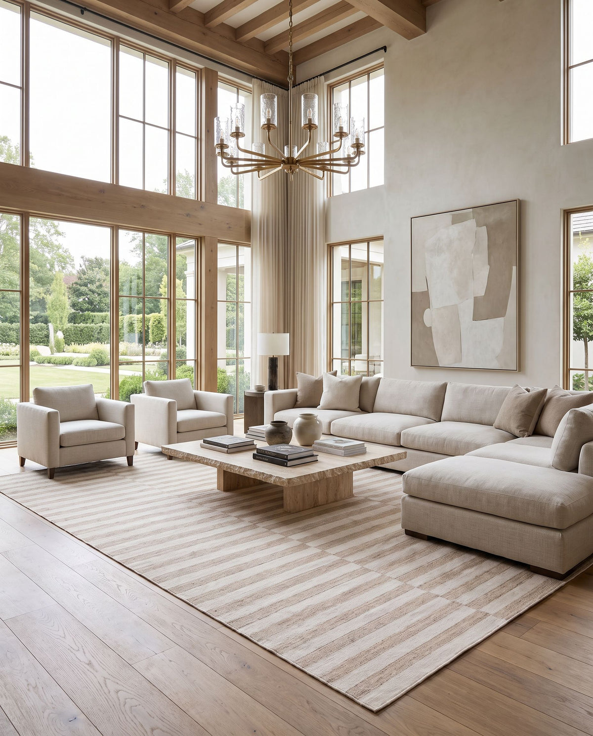 Santorini SNI-2302 Hand Loomed Rug as the centerpiece of a bright luxury living room — a hand loomed contemporary area rug in tan and off white tones